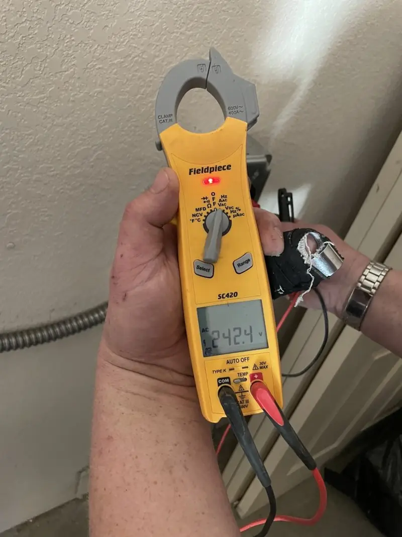 Voltage testing with clamp meter during Generator Installation in Fountainhead-Orchard Hills